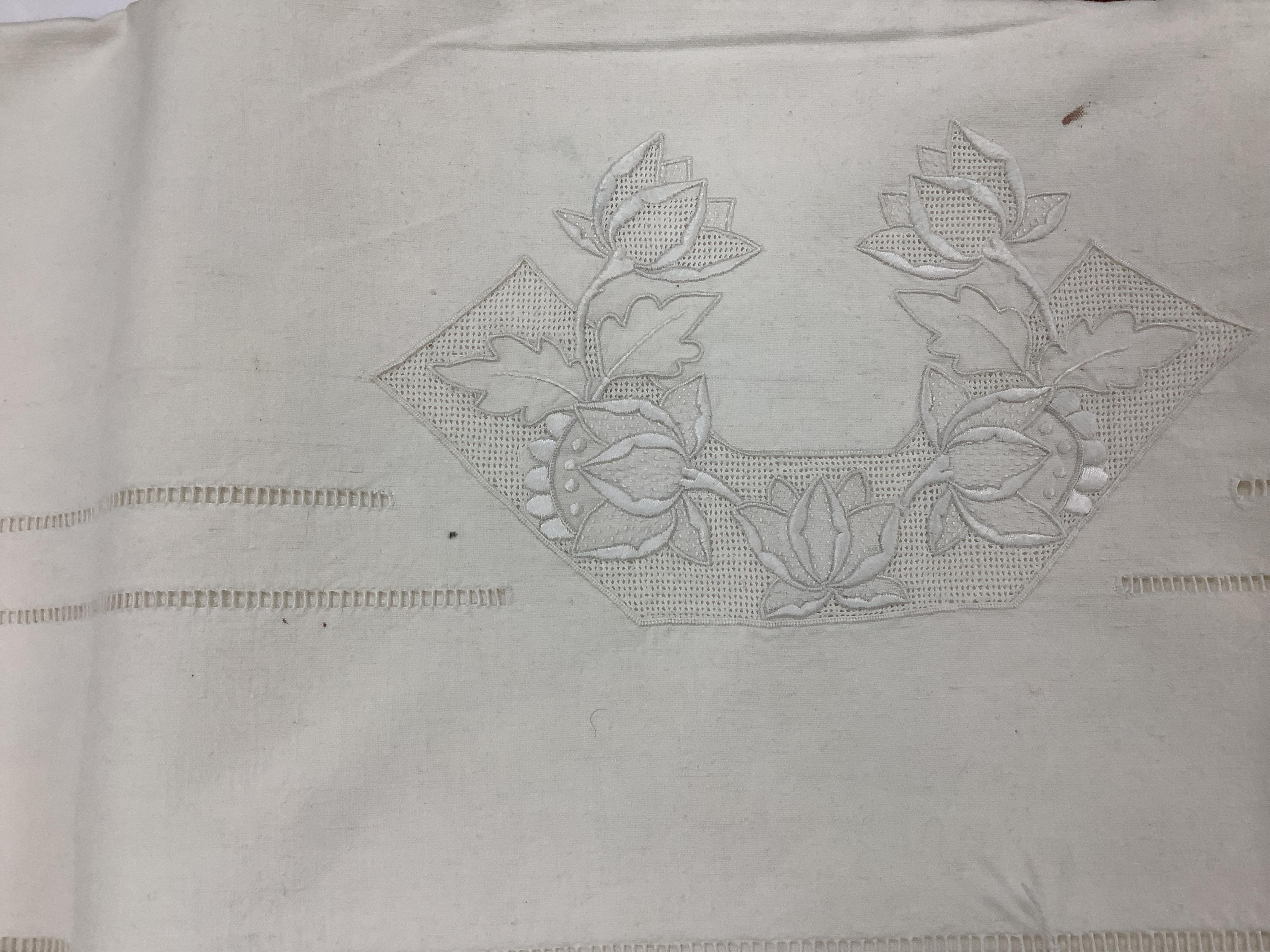 Four French provincial linen floral embroidered and drawn thread turn back, wide and long top sheets. Each sheet with different embroidery, dimensions and shades of linen, being ecru to off white. Condition - ecru sheet,